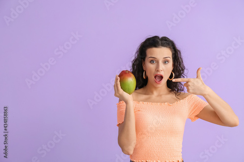 Beautiful woman pointing at...