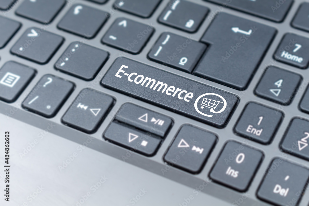 Online Shopping cart icon on keyboard key, e-commerce concept Online Shopping cart icon on keyboard key, e-commerce concept