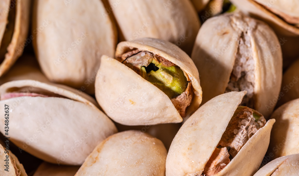 Close-up of pistachio. Selective focus on foreground.Pistachios texture. Nuts. Close-up of pistachio. Selective focus on foreground.Pistachios texture. Nuts.