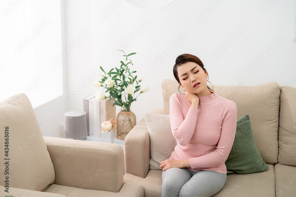 Beautiful woman is having pain in her neck.Neck pain Beautiful woman is having pain in her neck.Neck pain