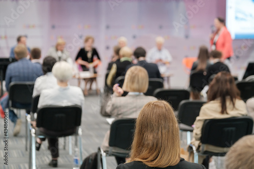 Business speaker doing presentation to audience