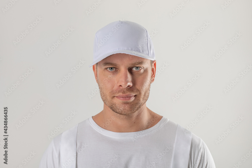 Male worker in a white cap. Mock-up. Male worker in a white cap. Mock-up.