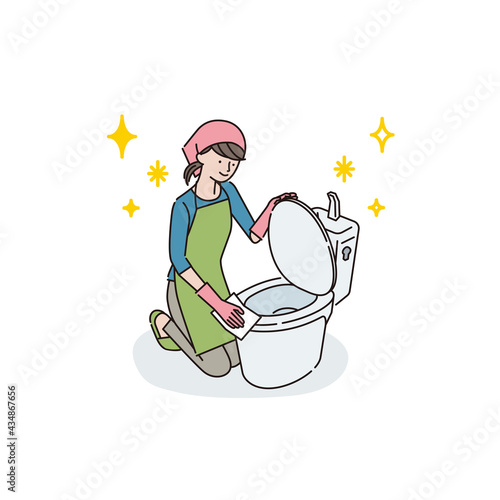トイレ掃除をする若い女性