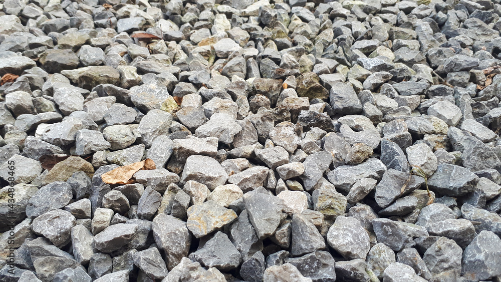 Gravel road texture. Small grey pebble patternt. Stone ground Gravel road texture. Small grey pebble patternt. Stone ground