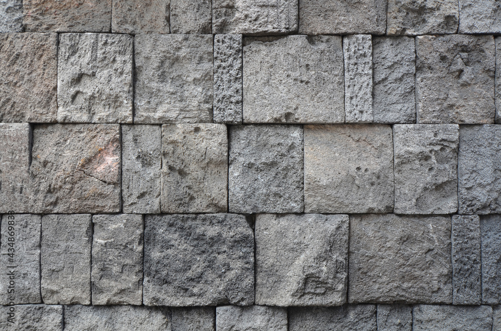 rustic gray granite block wall texture, building exterior or interior background rustic gray granite block wall texture, building exterior or interior background