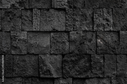 black granite block wall texture, building exterior or interior background