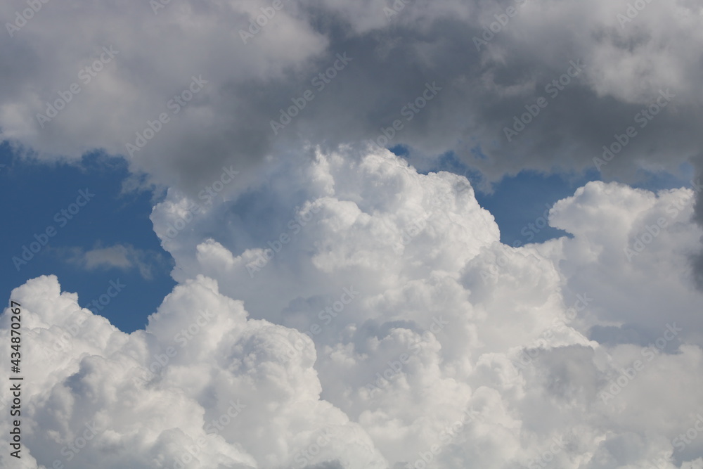 white fluffy clouds on blue sky in summer white fluffy clouds on blue sky in summer