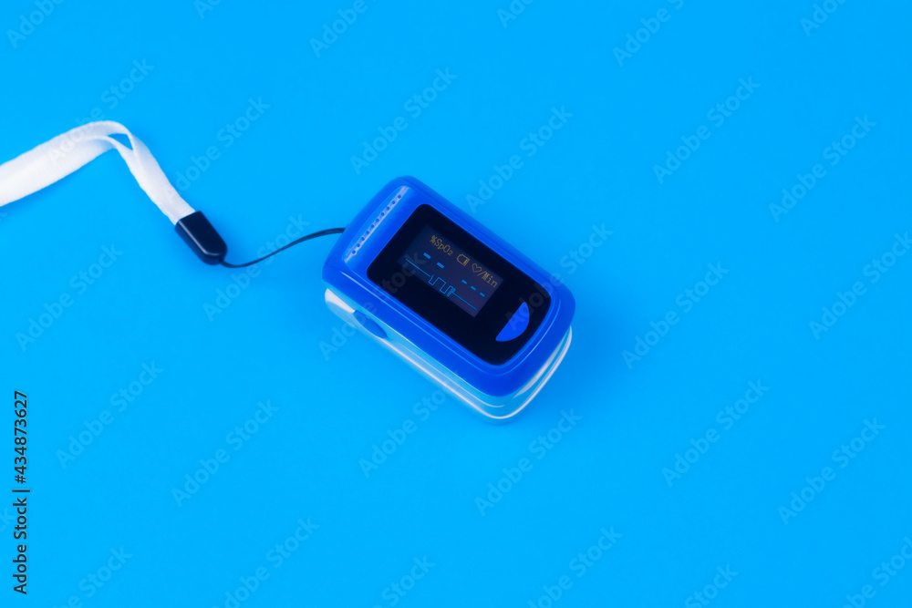 Pulse oximetry on blue background. Pulse oximetry a noninvasive and
