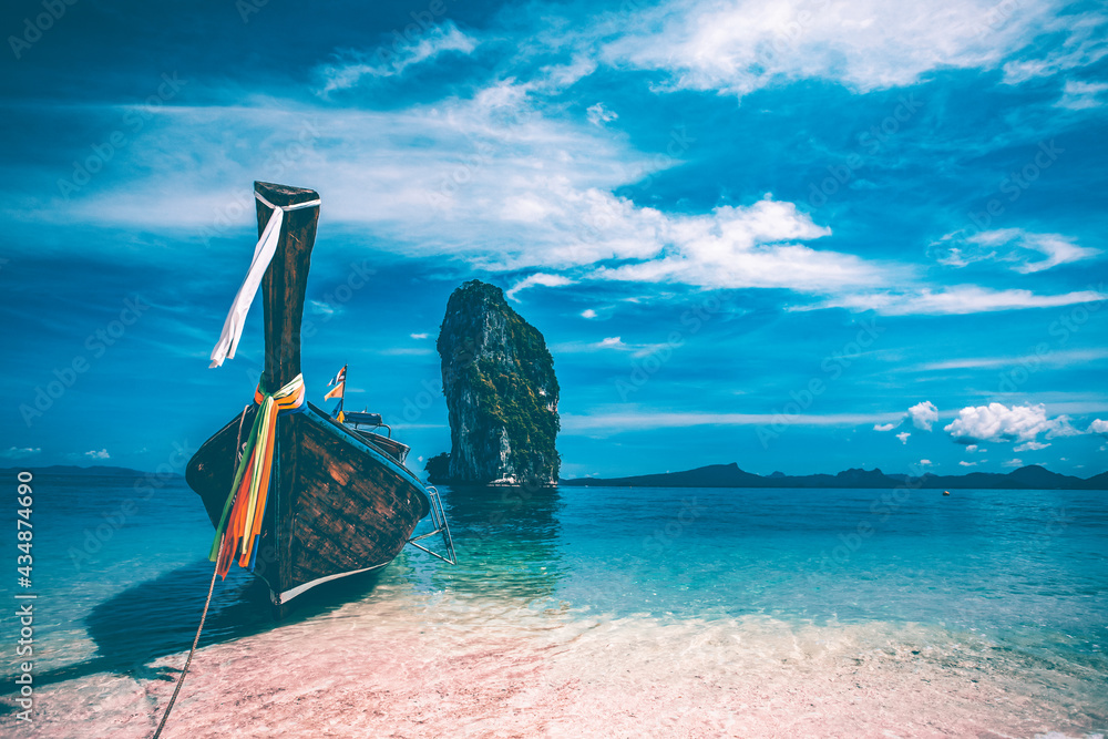 Traditional longtail boat and Poda island, Thailand.