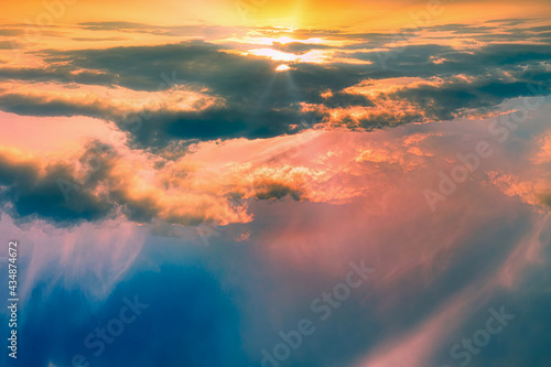 The salt rises above the pink and orange clouds - a gentle fairy-tale dawn - Dawn among bright fiery clouds at high altitude. Abstract photography.