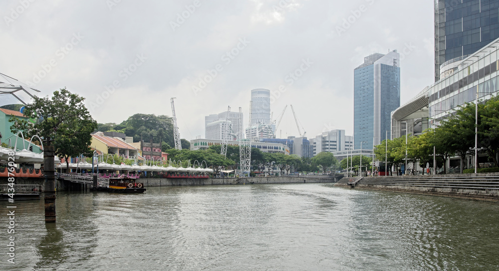  View of the embankment North Boat Quay. People do their own thing