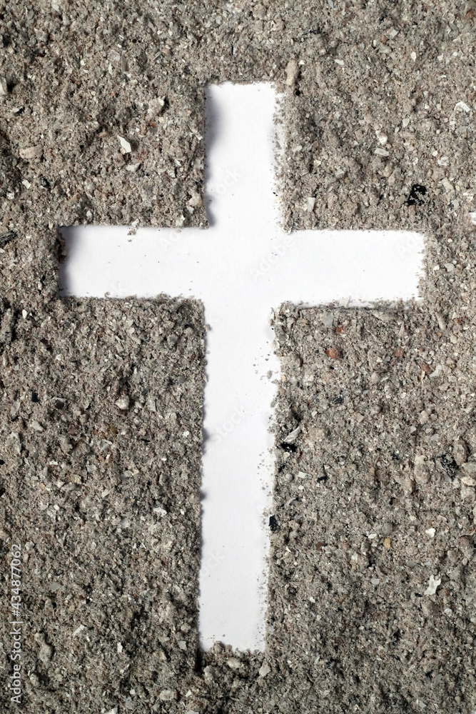 Cross made of ashes. Ash Wednesday. Lent season. France.