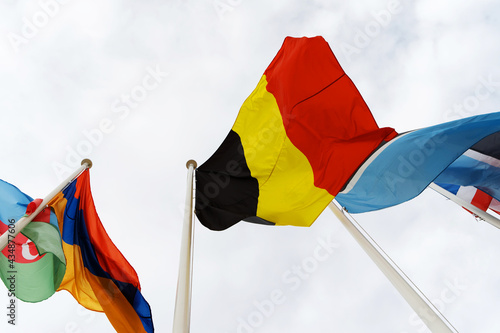 The German flag flies on a flagpole. Close-up