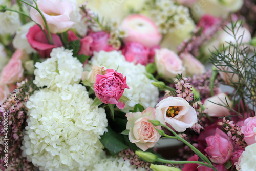 Floral composition of fresh roses, eustoma, ranunculus and astilba. Floral background.