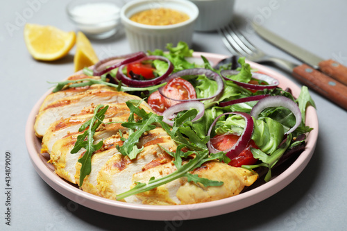 Tasty salad with grilled chicken, close up