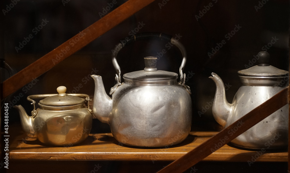 Aluminum kettle on a shelf in the kitchen
