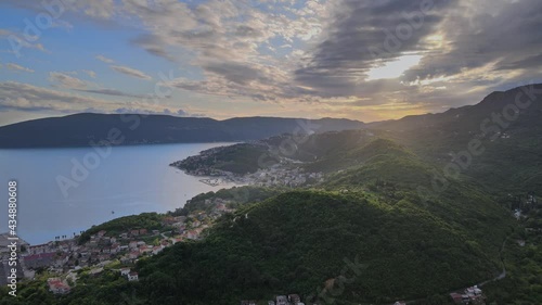 Aerial panoramic view of the Bay of Kotor, Herceg Novi, Montenegro, with the mountains at sunset photo