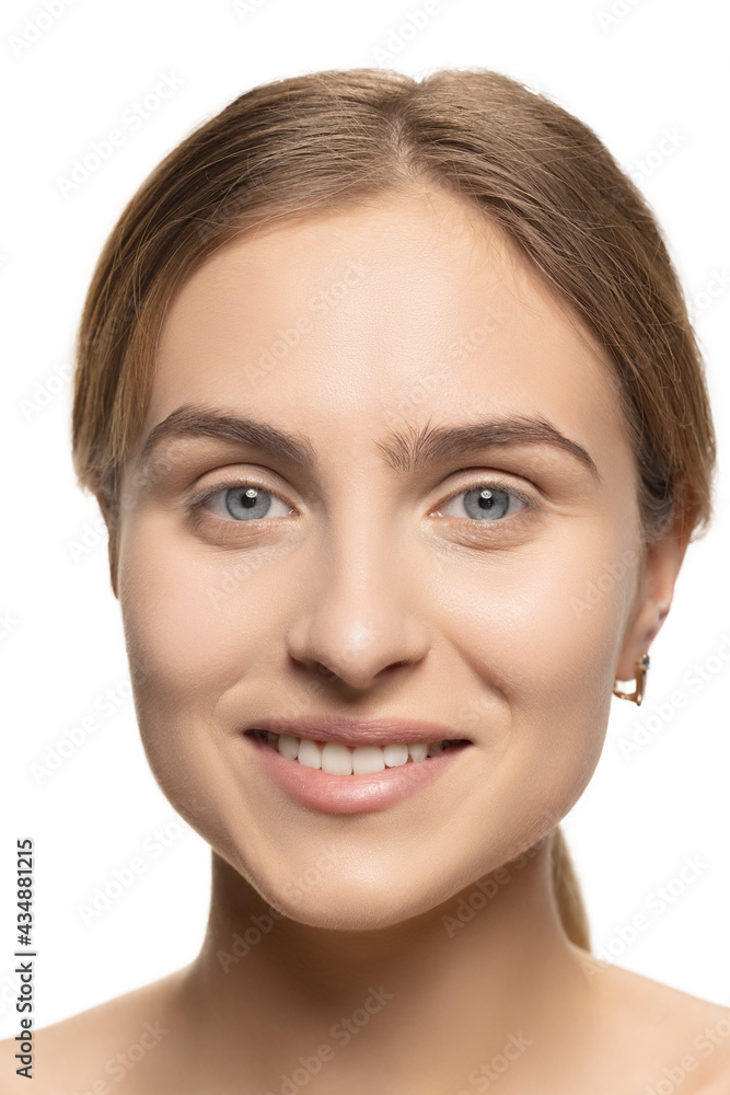 Close up portrait of young female fashion model isolated on white studio background. Beautiful caucasian woman with well-kept skin.