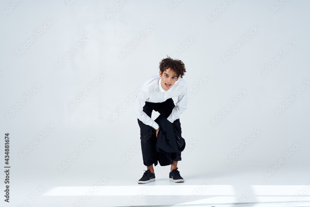 Cheerful man curly hair suit modern style fashion Cheerful man curly hair suit modern style fashion
