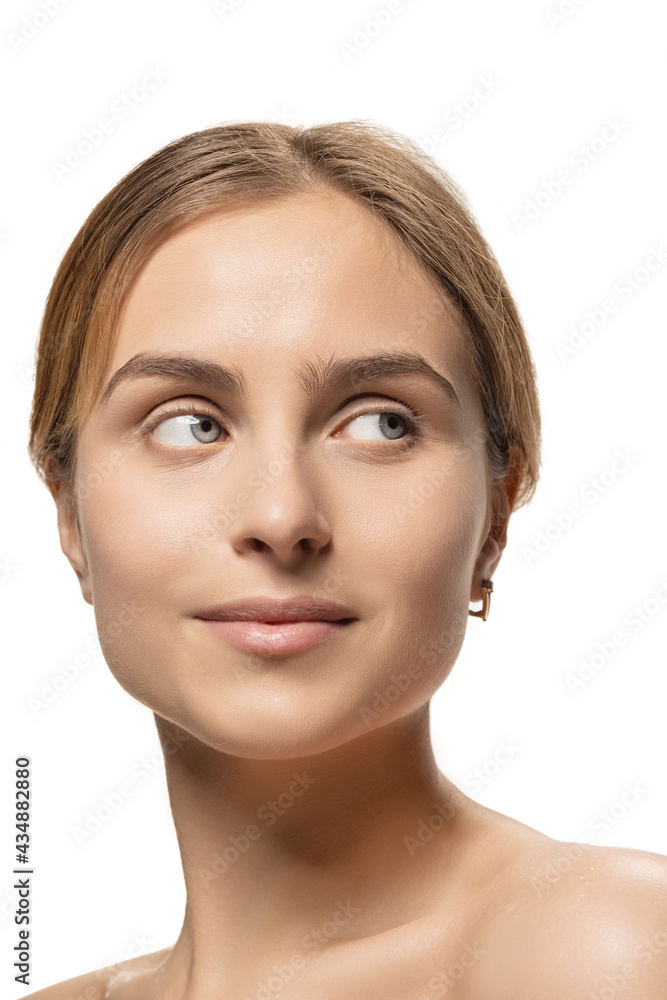 Close up portrait of young female fashion model isolated on white studio background. Beautiful caucasian woman with well-kept skin. Close up portrait of young female fashion model isolated on white studio background. Beautiful caucasian woman with well-kept skin.