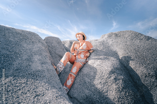 person sitting on a rock