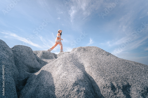 person sitting on a rock