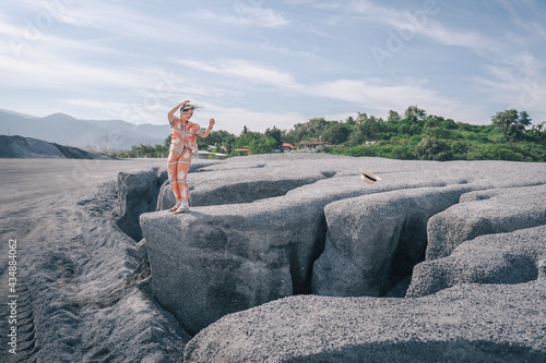 person sitting on a rock