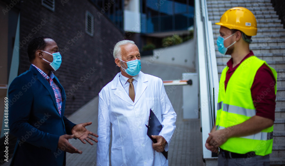 Business man, doctor and engineer on street. Business man, doctor and engineer on street.