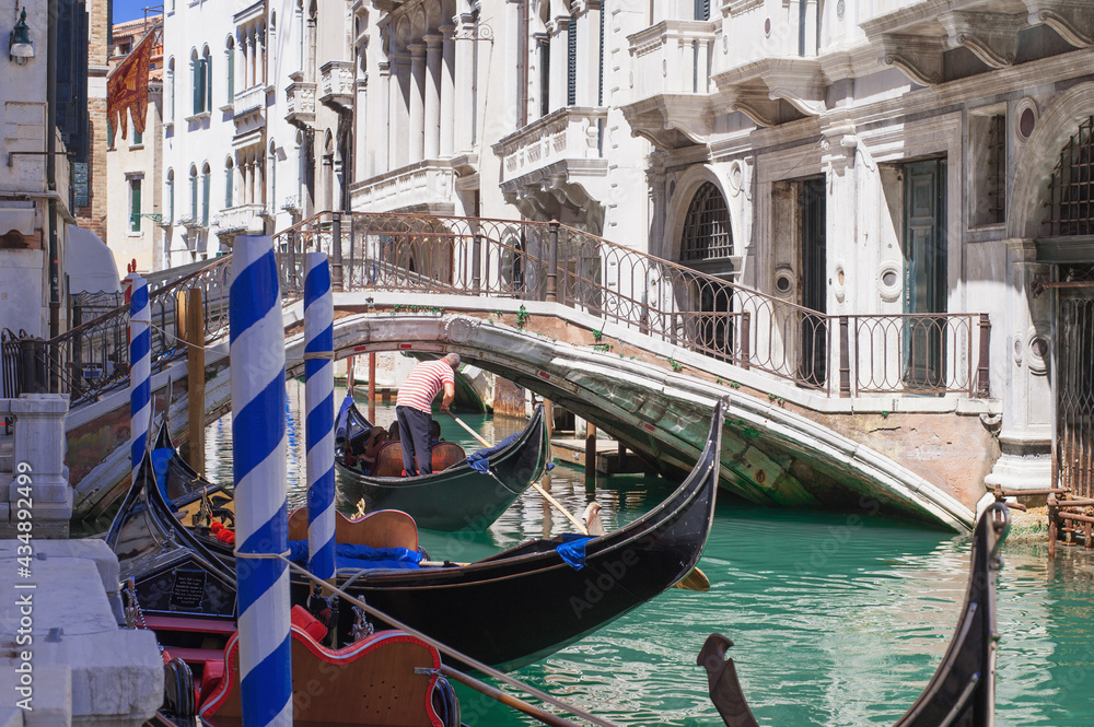 romantic idyllic views of the narrow canal street and renaissance facades of the city of Venice