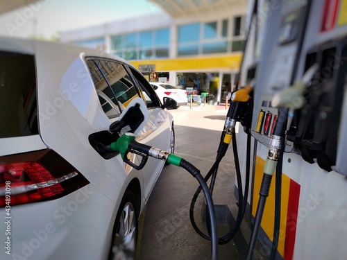 Car refueling in filling station. Gasoline and diesel pump.  photo