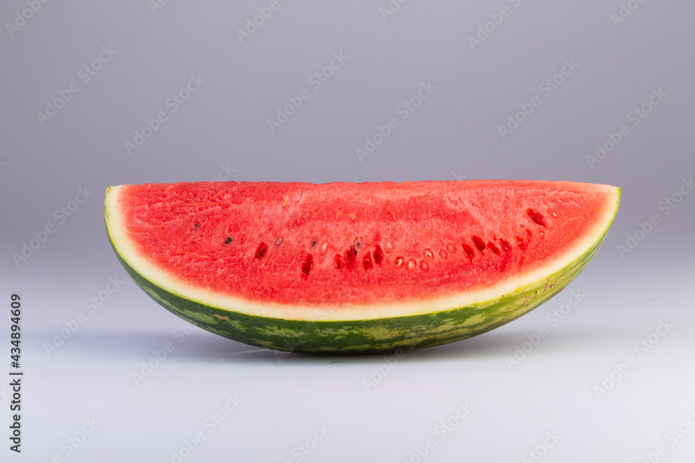 a quarter slice of watermelon isolated on a white background with clipping path. a quarter slice of watermelon isolated on a white background with clipping path.