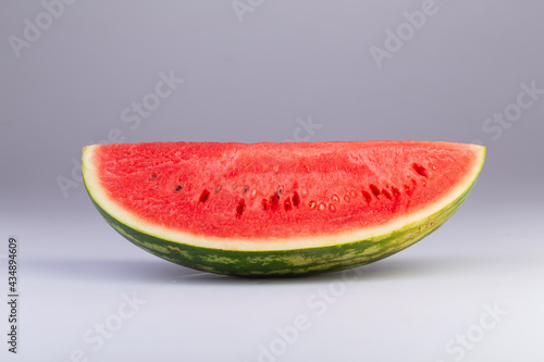a quarter slice of watermelon isolated on a white background with clipping path.