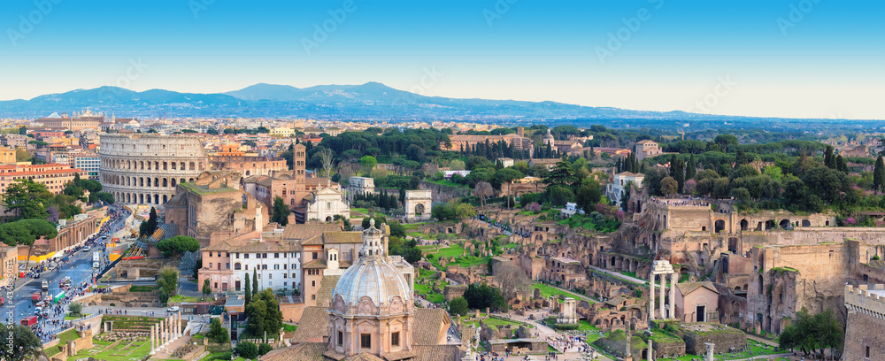 Panoramic view of Rome town with Colosseum and Roman Forum, Rome, Italy.