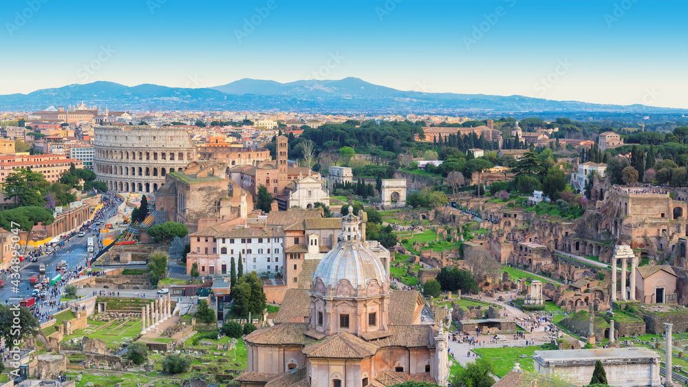 Rome, Italy. City skyline with landmarks of the Ancient Rome. Colosseum and Roman Forum, the famous travel destination of Italy.