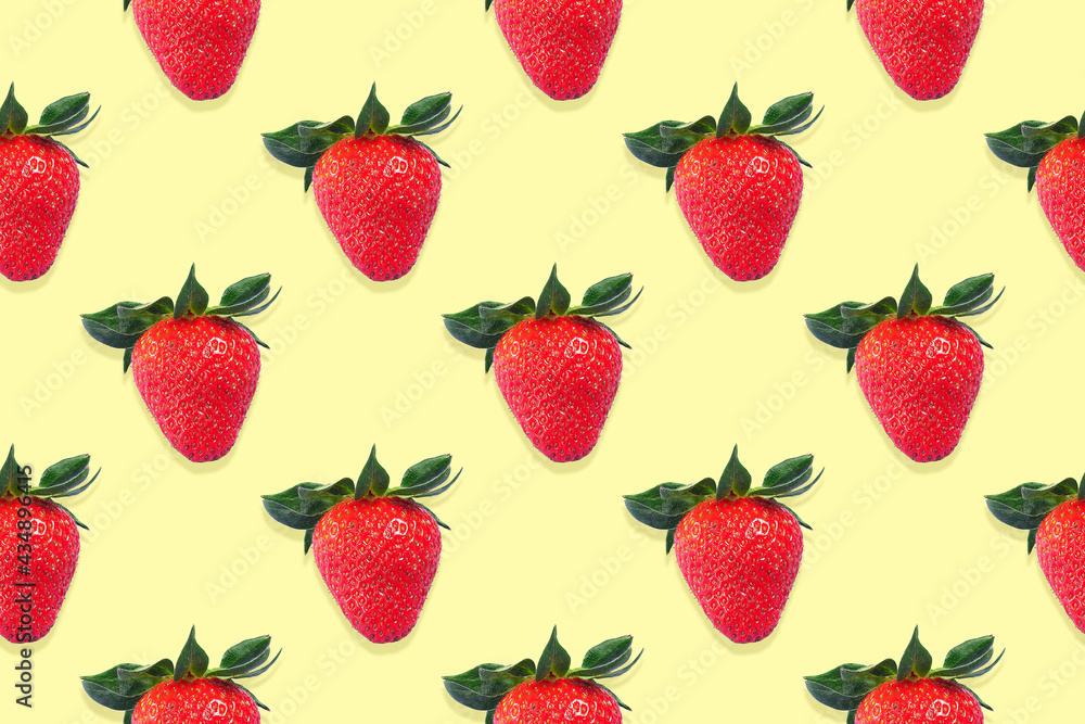 Seamless pattern of strawberries with green leaves on a yellow background Seamless pattern of strawberries with green leaves on a yellow background