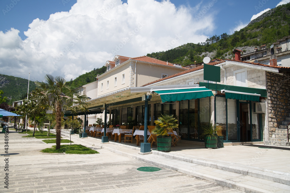 Open terrace of a cafe in a city in Montenegro.
