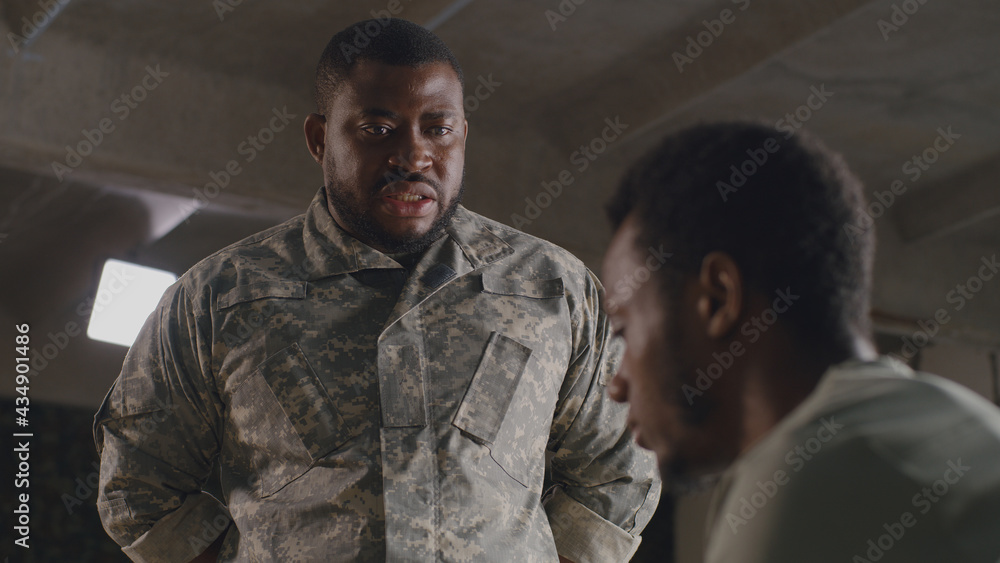 African American commander scolding soldier African American commander scolding soldier