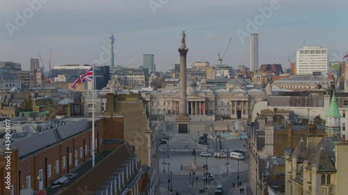 Aerial drone view over London tracking across Whitehall looking towards Nelson's Column and Trafalgar Square