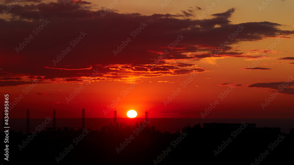 background of red dramatic beautiful sunset over the city