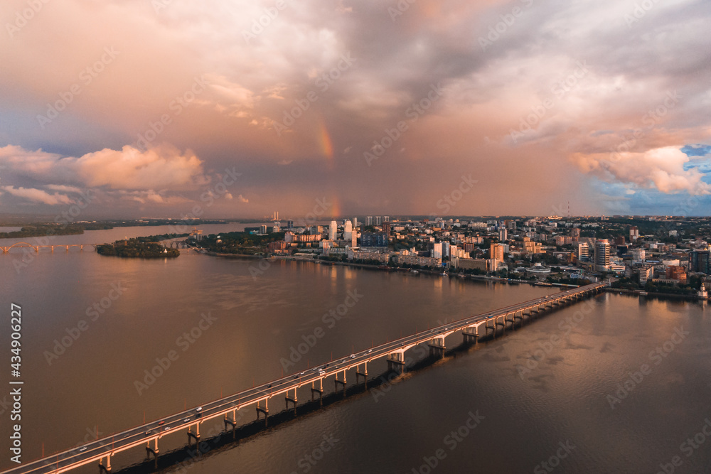 Rainbow is double in the most of photo. Beautiful double rainbow in the city after the rain. Photos taken from the drone