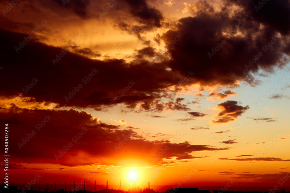 Fototapeta premium background of red dramatic beautiful sunset over the city