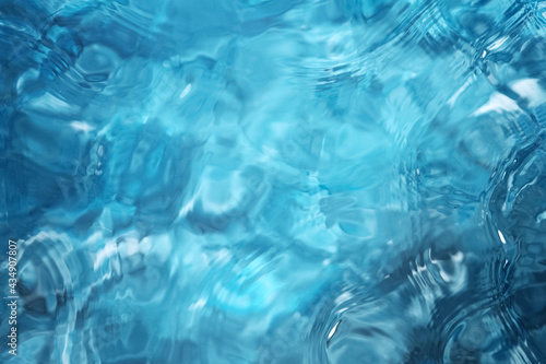 Blue water surface background, studio shot, texture of splashing abstract water shape