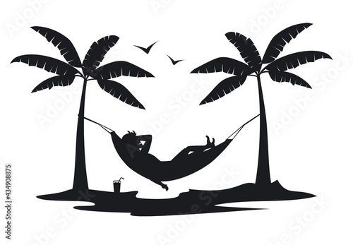 man relaxing in hammock on the beach at sunset silhouette.man relaxing in hammock on the beach at sunset silhouette. photo