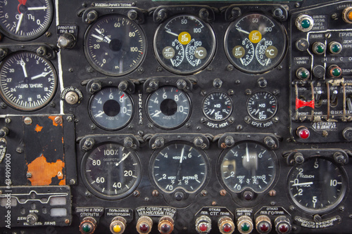 The dashboard of an old plane. Instruments and switches in the cockpit of an old plane