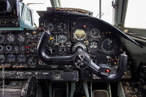 The dashboard of an old plane. Instruments and switches in the cockpit of an old plane © Илья Юрукин