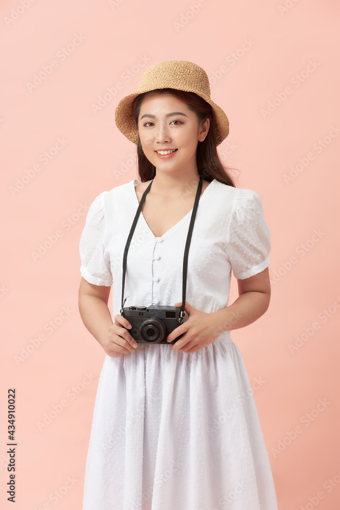 Attractive female photographer on pink Attractive female photographer on pink