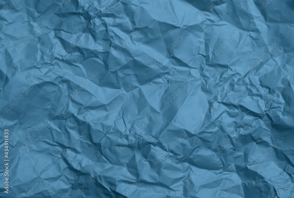 crumpled sheet of blue paper, creases and scuffs