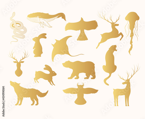 Hand drawn vector isolated illustration of golden animals silhouettes. Gold Icons of hare  deer  wolf  bear  owl  whale  stingray  jellyfish  panther  eagle.