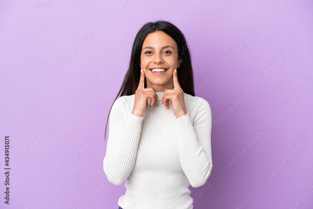 Young caucasian woman isolated on purple background smiling with a happy and pleasant expression Young caucasian woman isolated on purple background smiling with a happy and pleasant expression