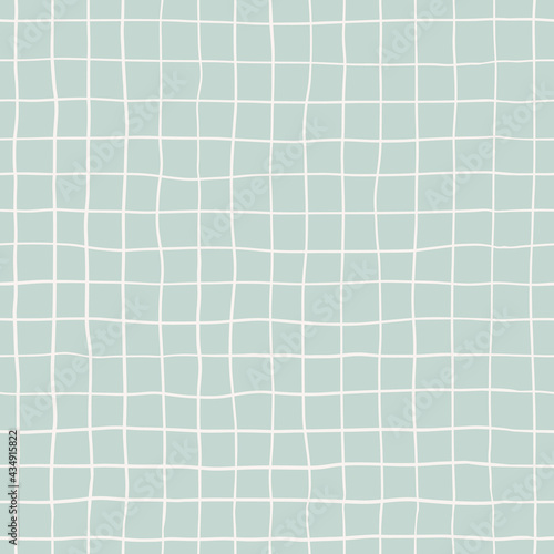 Seamless plaid pattern with white hand drawn doodle lines on a blue background. Abstract boho texture in retro style for wrapping paper, covers and fabric.